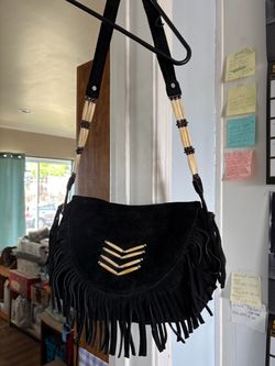 Suede western purse with fringe and bone.10 inch by 13 inch