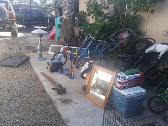 A lot of stuff for sale; bikes, strollers,dog cages, vaccum, generator, heater, sink, tires and other stuff ask for prices