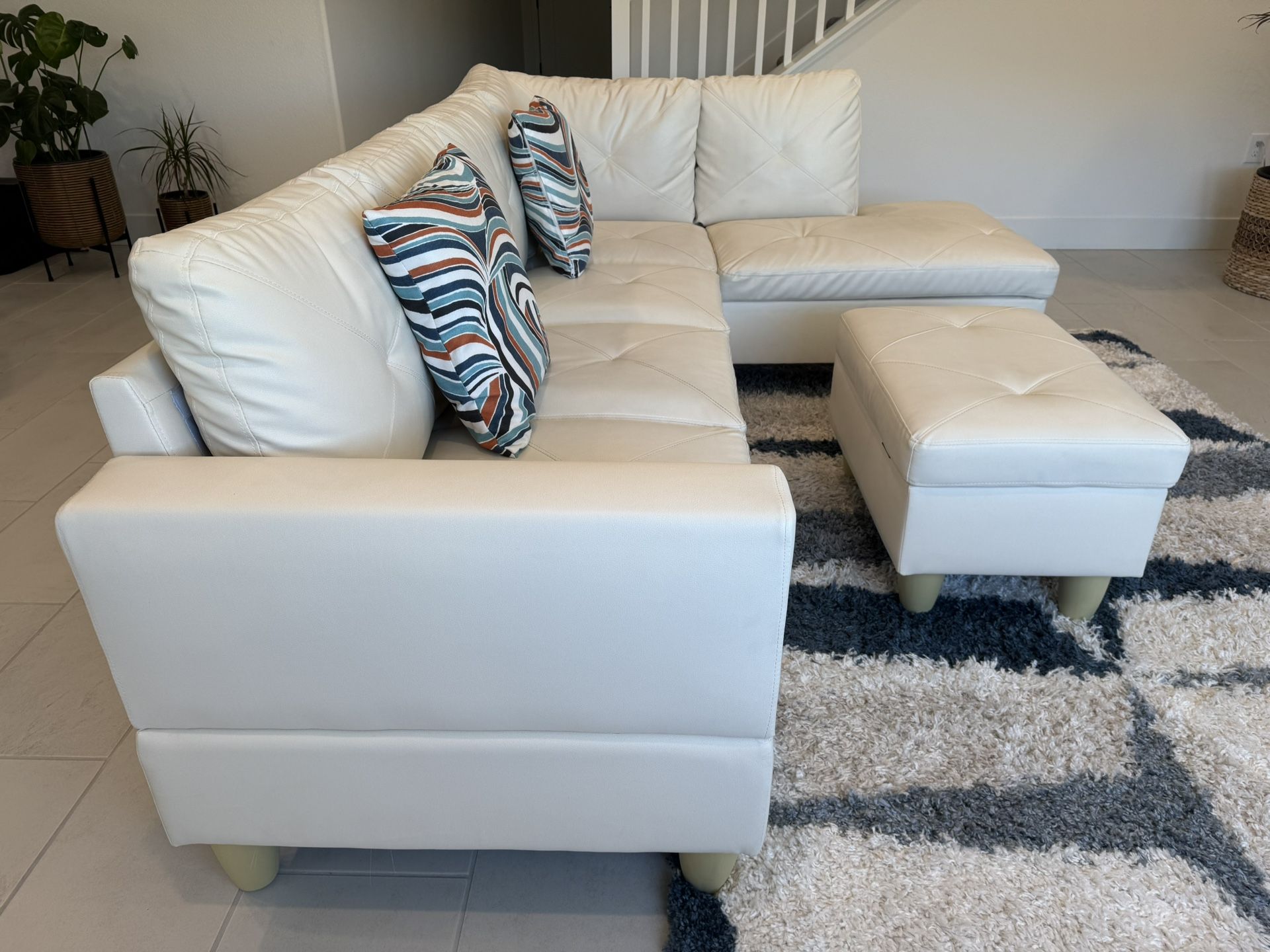 3 Piece White Faux Leather Sectional With 2 Rugs