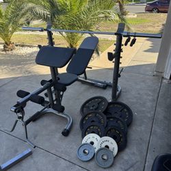 Bench press/squat rack with 7ft 45lbs bar plus 240lbs of Olympic weights