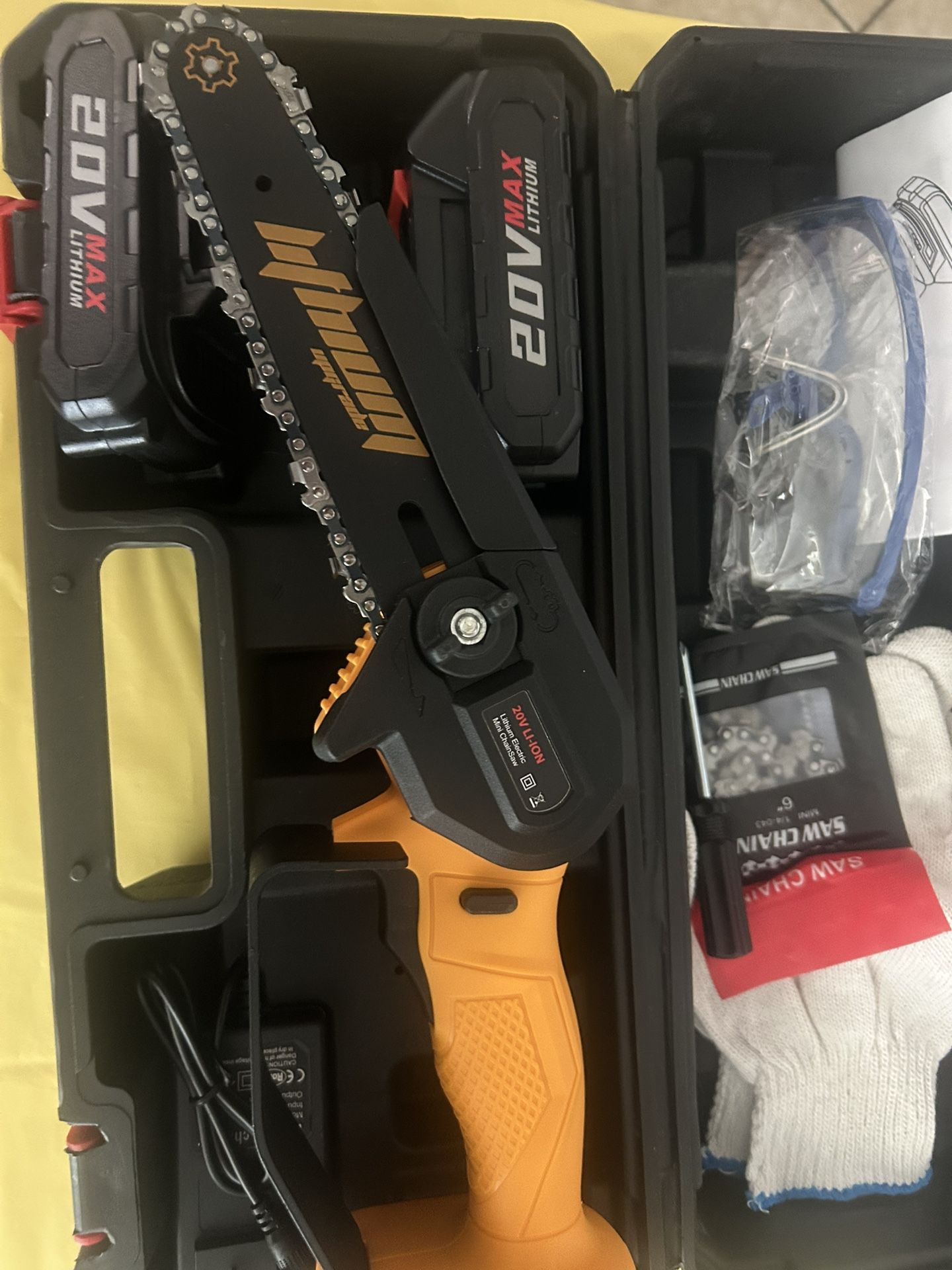 6 inch lithium chainsaw. It comes with two batteries, safety gloves, and safety gloves
