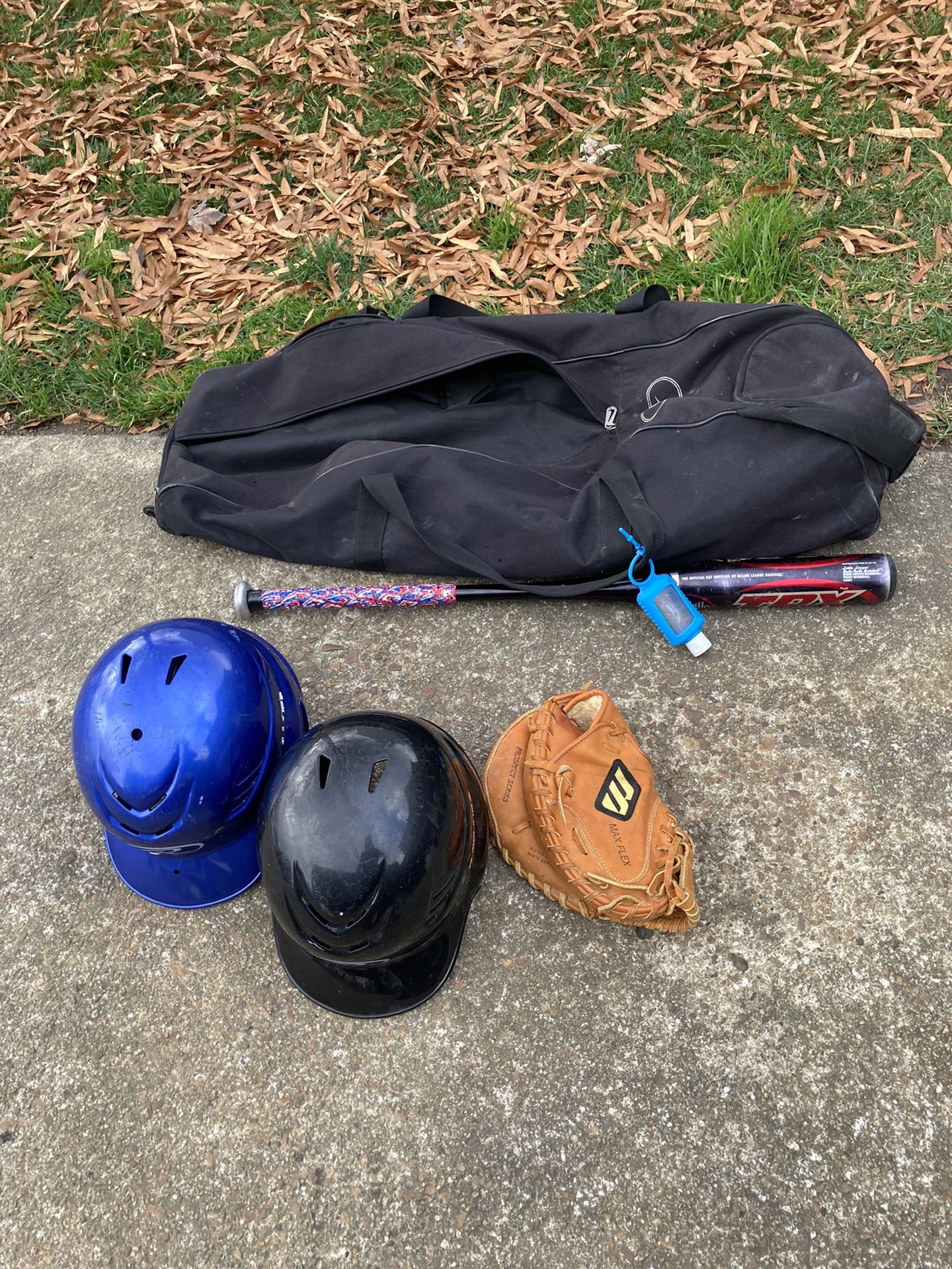 Baseball stuff includes two youth helmets bat  adult glove 