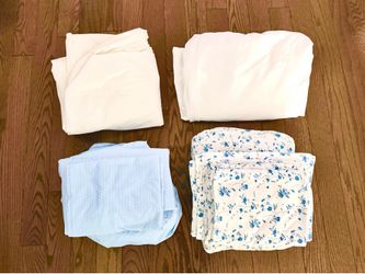 2 Twin XL sheet sets, mattress cover and bed skirt