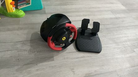 Red and black Ferrari themed steering wheel with breaking gas pedal for (Xbox one)