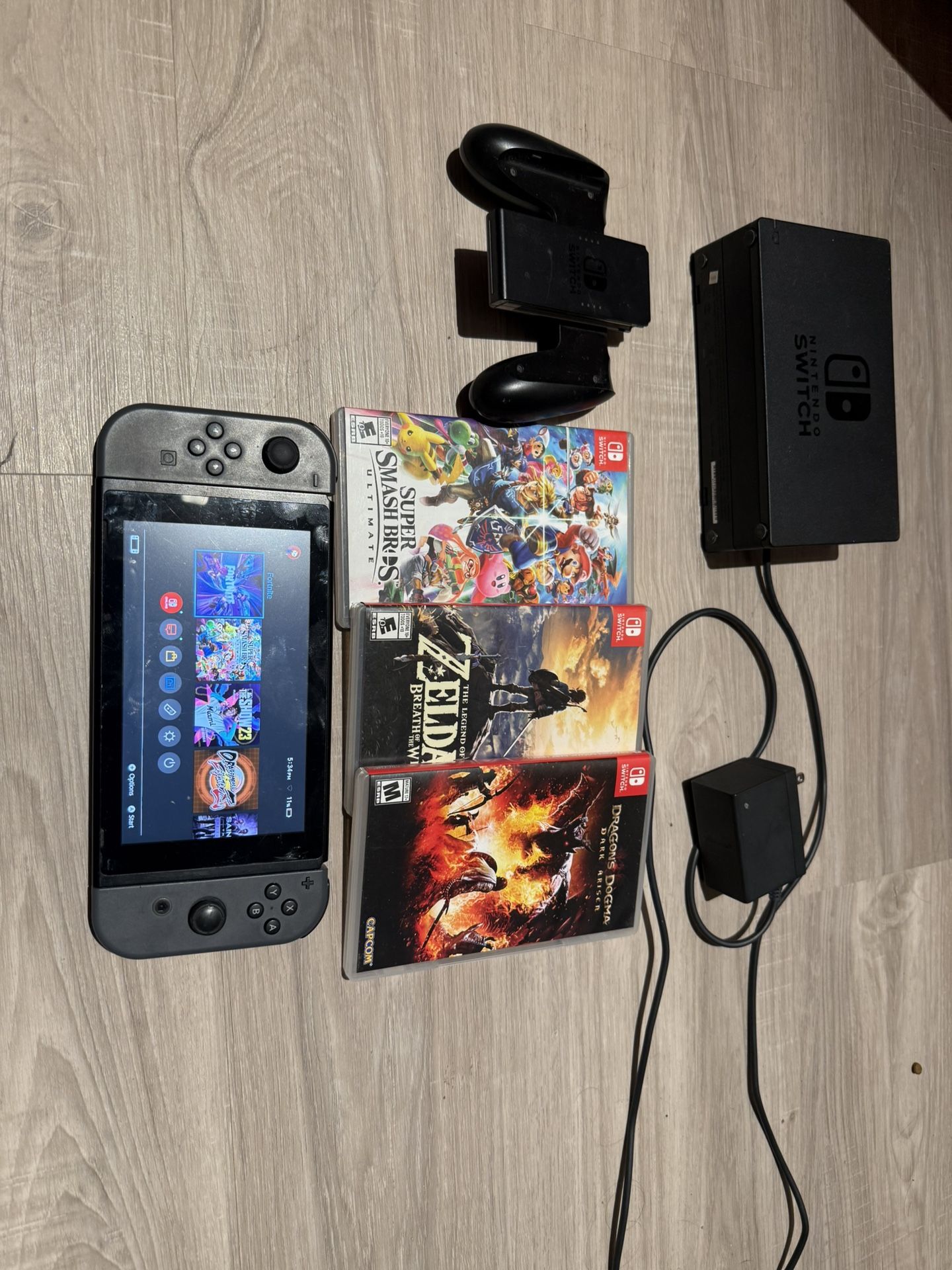 NINTENDO SWITCH + CHARGER DOCK + 3 PHYSICAL GAMES