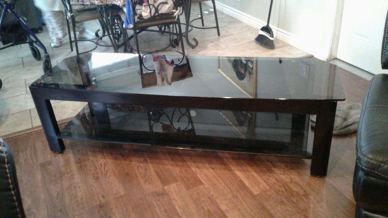 Glass black TV Stand in very good condition firm price
