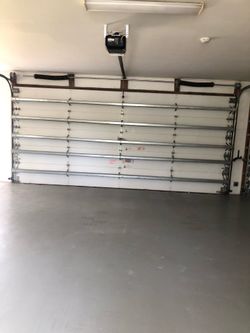 Garage Door Broken Spring Opener Off Track Adjustment Replace And Parts