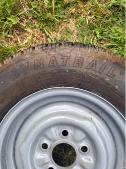 Two Drynatrail radial tires for a trailer with rims . Good tread!