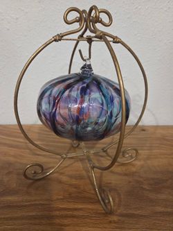 Blown glass ball with Cinderella coach stand