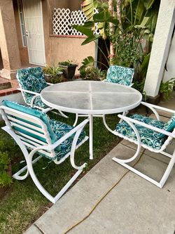 Patio table with 4 chairs, cushion and umbrella