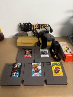 NES console with games
