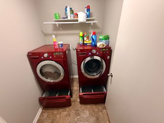 LG front-load washer and dryer set with matching storage pedestals.