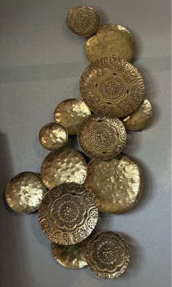 Gold colored metal plate wall decoration