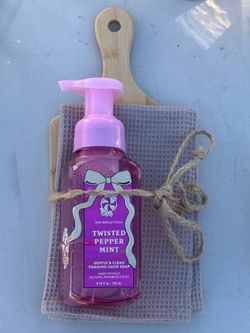 Hand soap, kitchen board, kitchen towel.