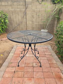 Black Wrought Iron Outdoor Table (40" W x 29" H) with Umbrella Hole
