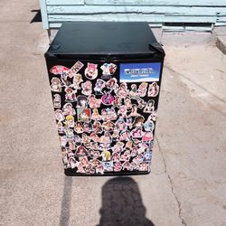 Mini Fridge Coverd With Anima Stickers 