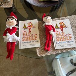 Girl elf on the shelf and a boy elf on the shelf