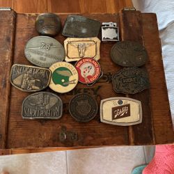12 Belt Buckles And a Lighter 