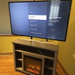 Samsung TV And Stand With Fire Place