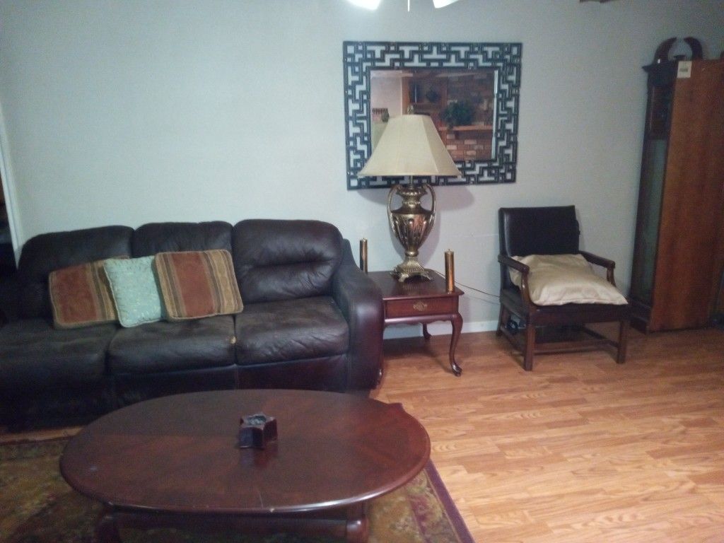 2 Leather Couches,1 End Table,1 Lamp,1 Leather Chair