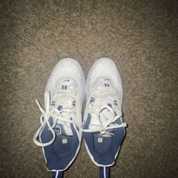 Nike Air Definition trainers in white and navy blue.