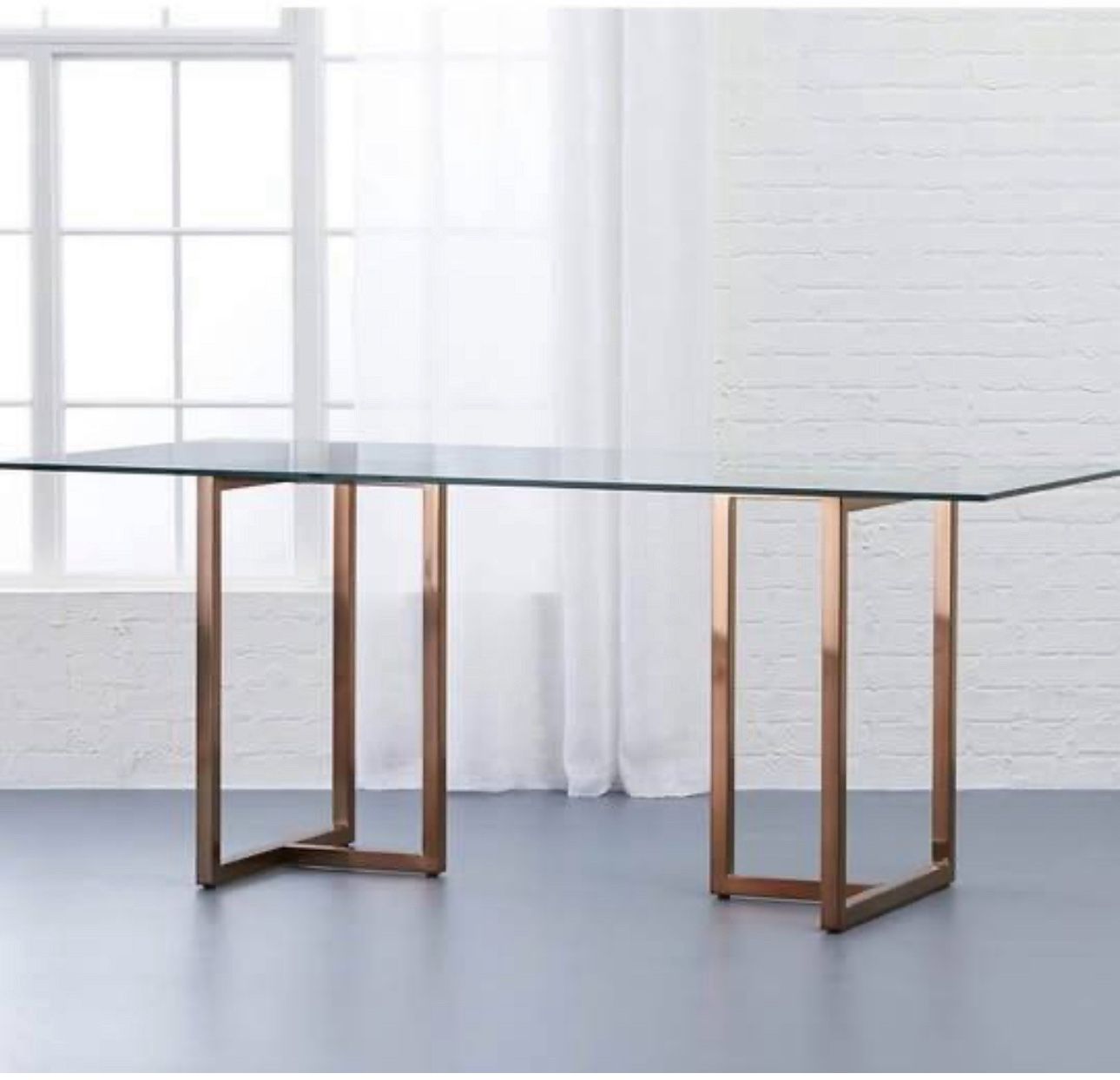 CB2 Silverado Brass & Glass Dining Table – $975 (Compare at $2,499)