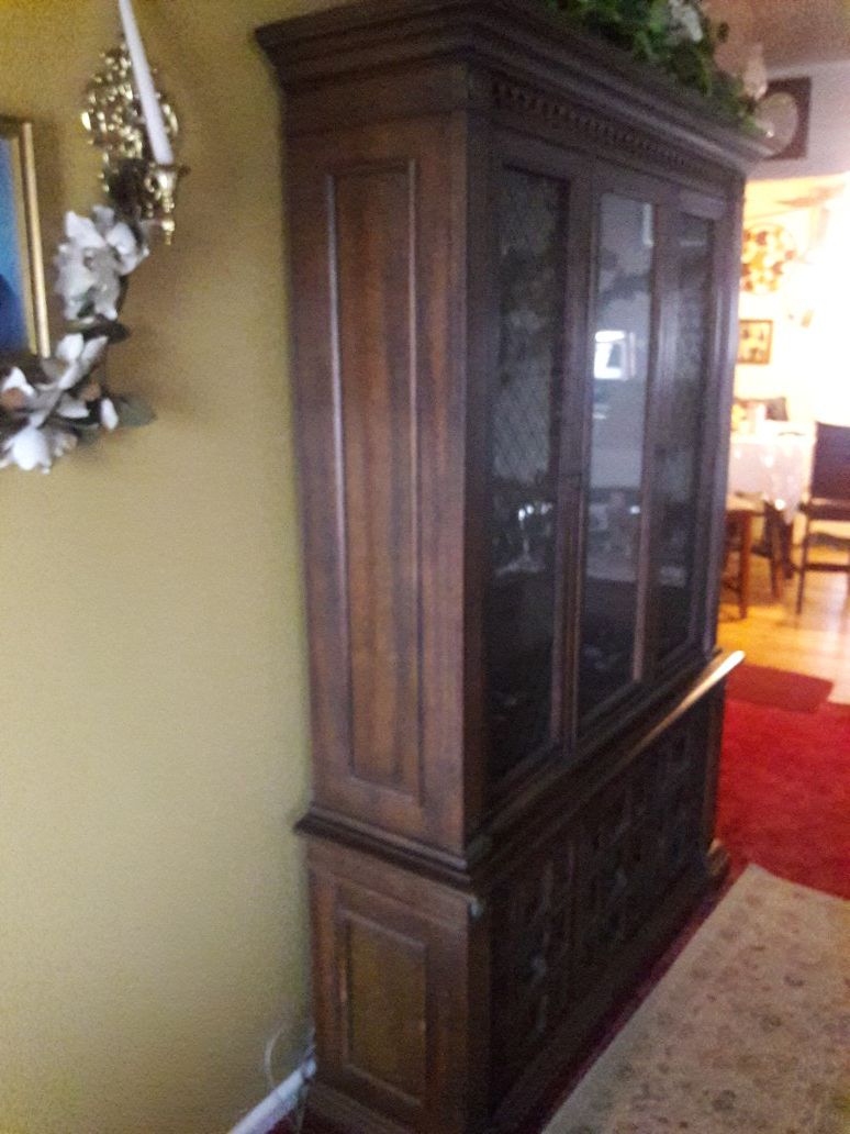 Antique china hutch with a light on the inside