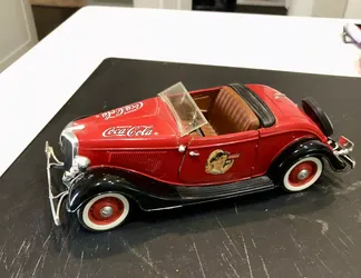 Vintage 1990's coca cola die cast Ford roadster model automobile and green pickup truck both with stands located in palm springs ca