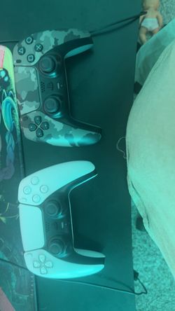 PS5 and 2 controllers