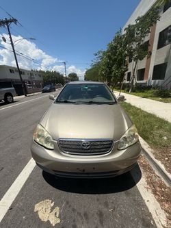 Toyota Corolla LE 2004 • 140K Millas • Cámara 3 Vías • Pantalla Bluetooth • Título Limpio