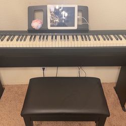 Electric piano with chair