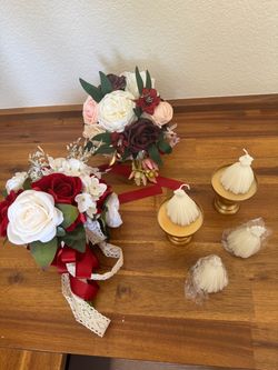 Selling two beautiful bouquets for wedding, birthday, bridal shower, and four white dress mini candles for you