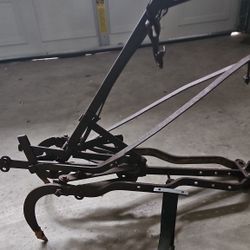 Image shows an antique horse-drawn plow, likely a John Deere model, designed for tilling soil