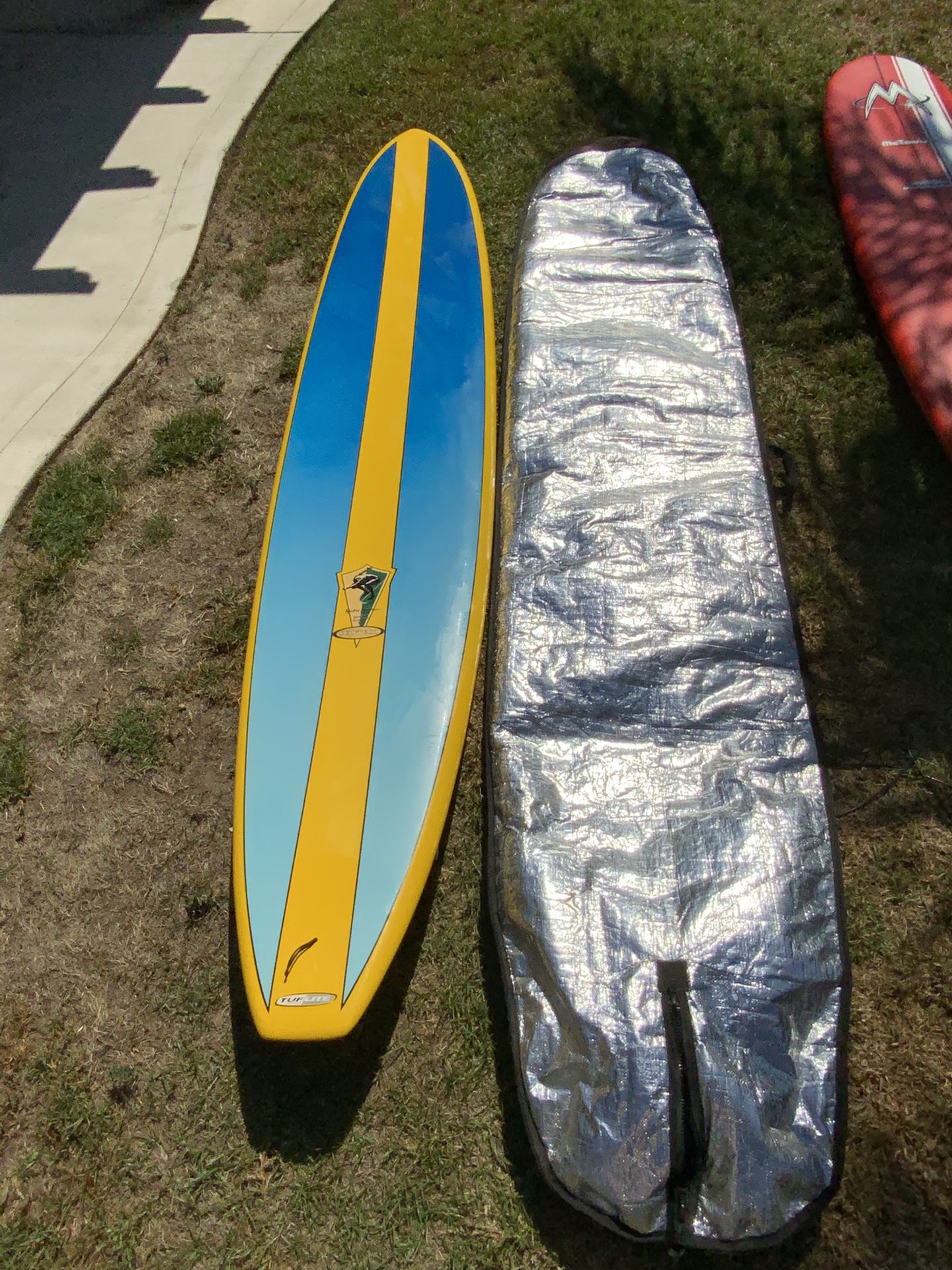 Surftech Mickey Munoz "The Glide" 10’6” longboard surfboard And dakine Cover.