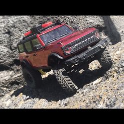 Scx24 Ford Bronco With Upgrades Wheels And Tires And Signatures Of Monster Truck Drivers For Sunofadigger And Gravedigger.