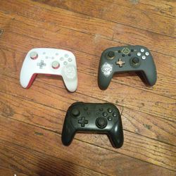 Nintendo Switch Pro Controller and PowerA Enhanced Wireless Controllers.