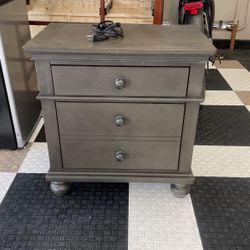 Greenish/grey electric night stand. 