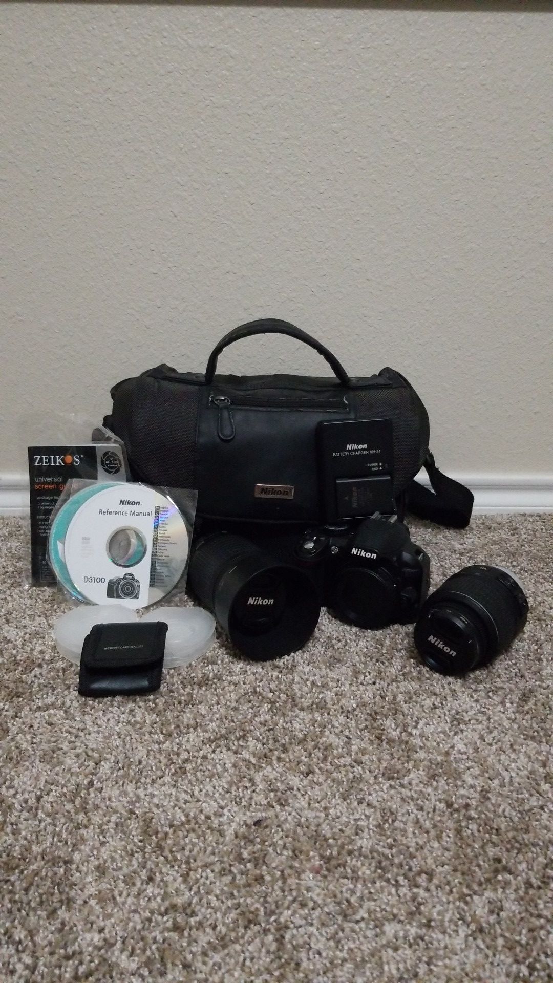 Nikon D3100 with 18-55mm and 55-200mm lenses.