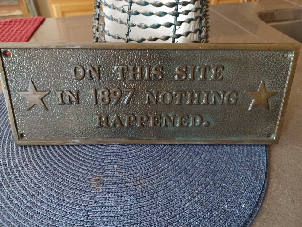 METAL PLAQUE ON THIS SITE IN 1897 NOTHING HAPPENED