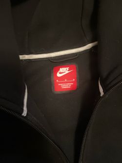 Black and gray Nike tech
