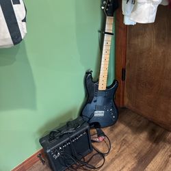 Black Fender guitar with case, amp, amp cord, guitar strap, and capo #rockmusic #guitarlove   E STRING RIPPED/NEED REPLACEMENT 