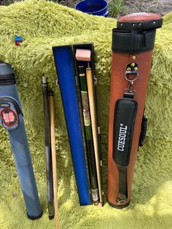2 pool sticks, 3 cases