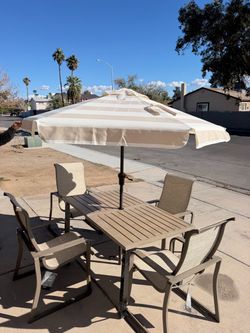 BRAND NEW PATIO DINING TABLE SET WITH CHAIRS BY ASHLEY DESIGN. Umbrella is free
