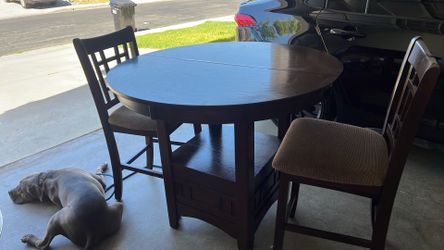 Wood dinner table with 5 chairs and extension