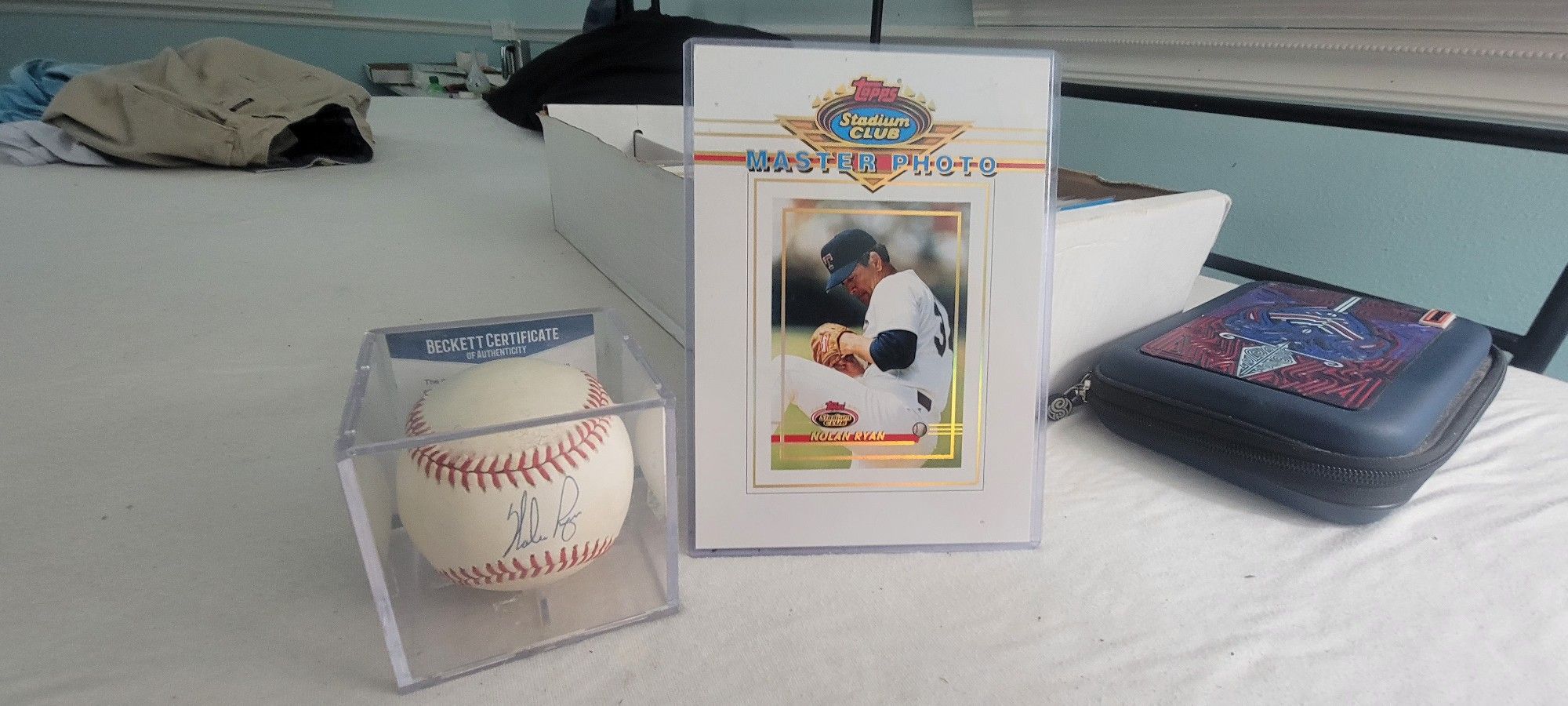 Nolan Ryan Autographed Baseball With Beckett COA And Topps Photo