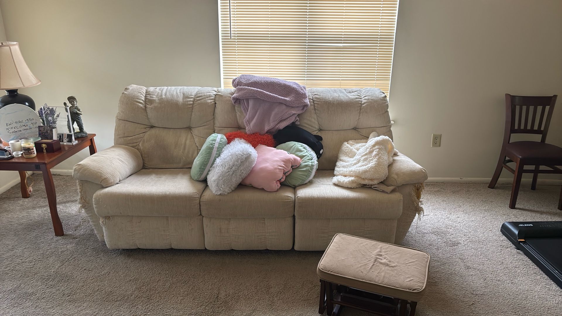 White Couch With Assorted Pillows 