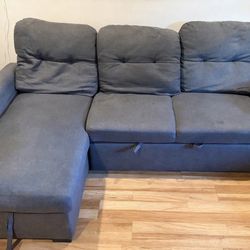 gray sectional with pull-out bed / chaise Storage – great for small spaces