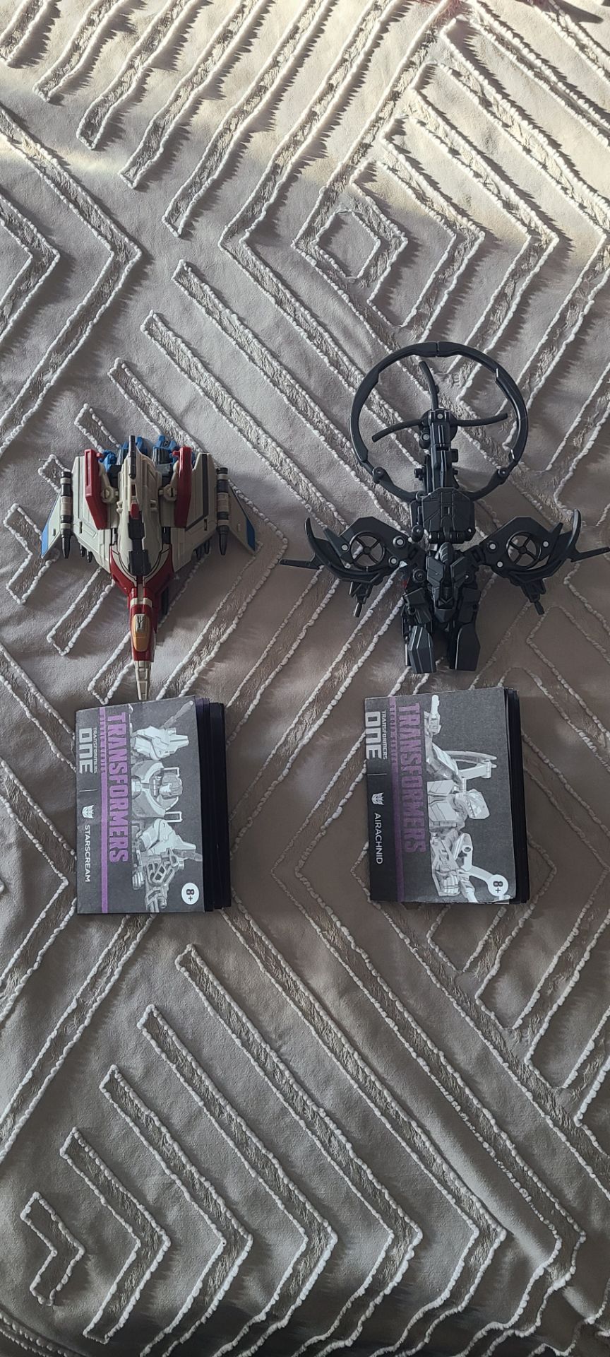 Transformers one studio series starscream and airachnid