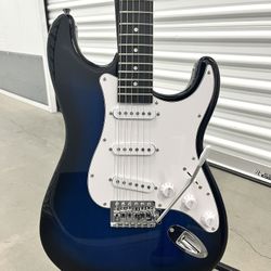 BRAND NEW - Translucent Blue Strat Style Guitar w/ Case, Strap, and Accessories