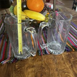 Tall heavy beer mugs.